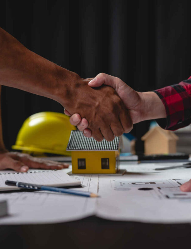 Architects, Engineers, Designers hand in hand to collaborate, invest, plan, work on concepts, planning, blueprints, brainstorming, inventing real estate project construction concepts.